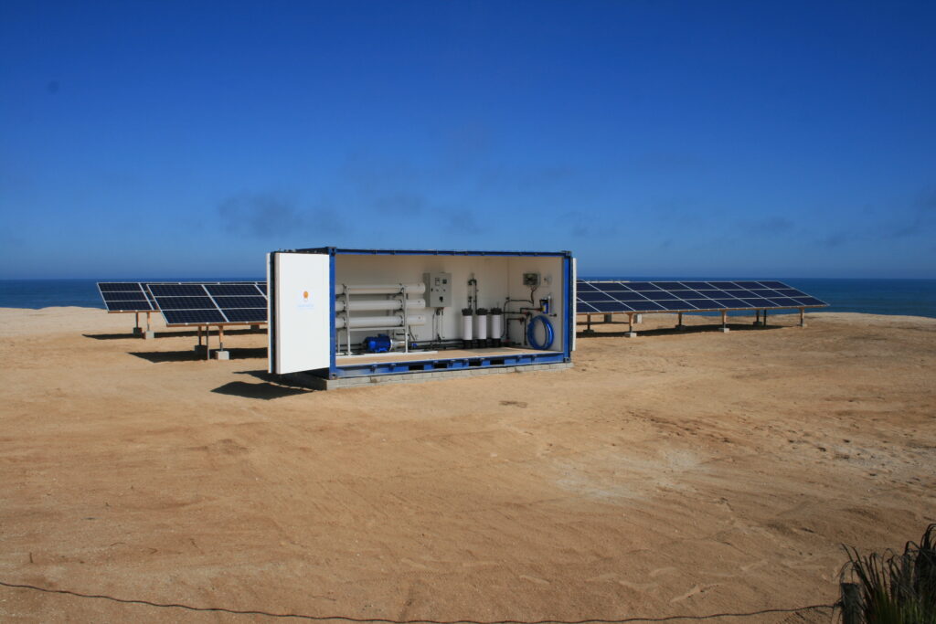 Commercial solar-powered reverse osmosis desalination system in containerized off-grid coastal installation